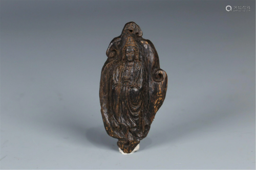A CHINESE CHENXIANG WOOD CARVED GUANYIN PENDANT