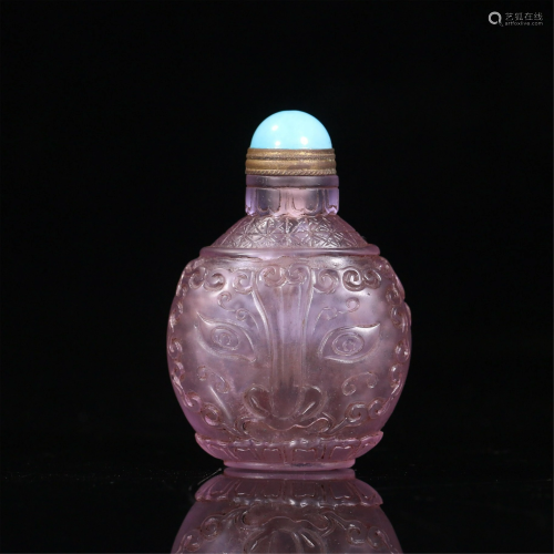 A CHINESE INCISED COLORED GLASS SNUFF BOTTLE