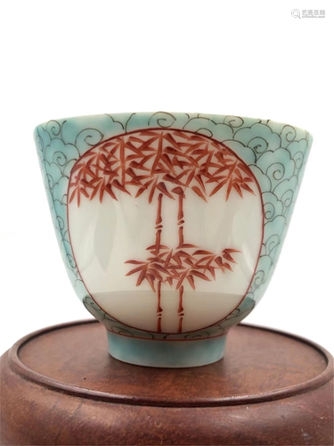 A FAMILLE ROSE AND IRON-RED BAMBOOS PORCELAIN CUP