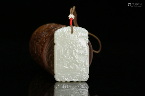 A CHINESE JADE CARVED FIGURAL PENDANT