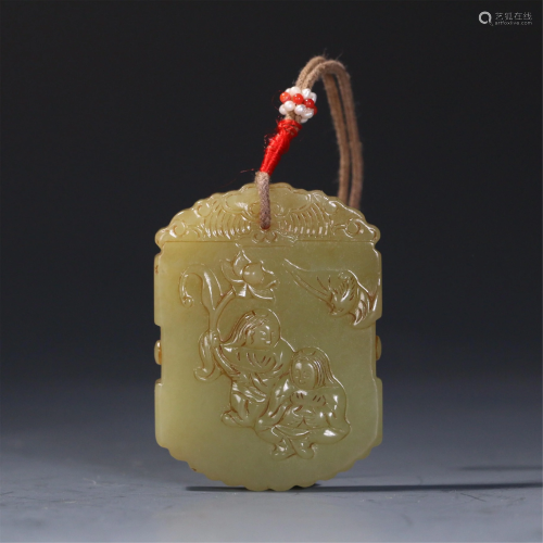 A CHINESE YELLOW JADE FIGURAL PENDANT