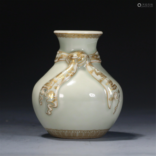 A CHINESE PEA GREEN GLAZE GOLD-PAINTED PORCELAIN VASE