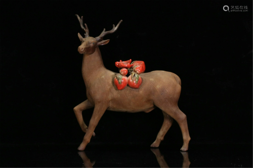A CHINESE YIXING CLAY DEER AND POLYCHROME PEACHES