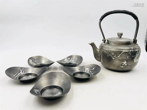 A SET OF DELICATE TIN TEA WARES