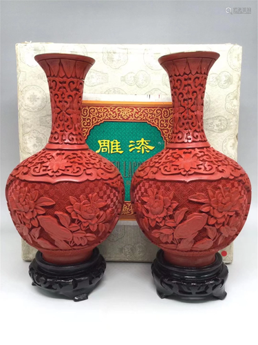 A PAIR OF CARVED RED LACQUER FLORAL GLOBULAR VASES