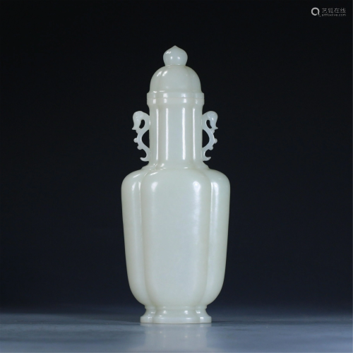 A CHINESE JADE VASE WITH COVER AND DOUBLE HANDLES