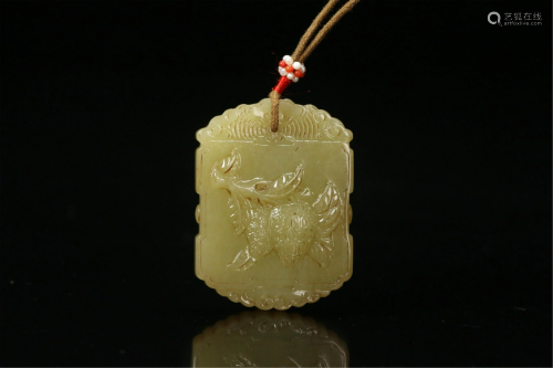 A CHINESE YELLOW JADE CARVED PENDANT