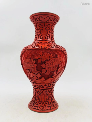 A CARVED RED LACQUER FLORAL VASE