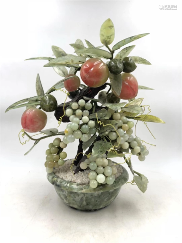 A PEACHES AND GRAPES BONSAI WITH JADE FLOWER POT