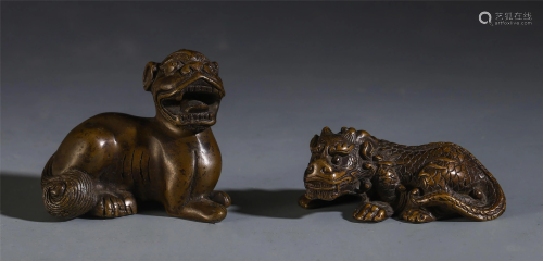 A PAIR OF CHINESE BRONZE MYTHICAL BEASTS