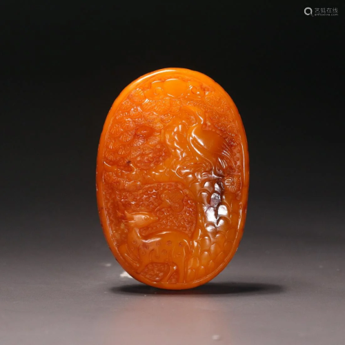 A CHINESE CLOUDY AMBER CARVED CRANE AND DEER PENDANT