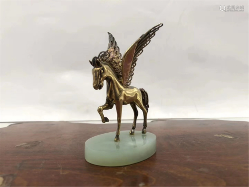 A SILVER GILDING FLYING HORSE DECORATION