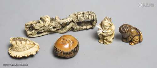 Two Japanese stag antler netsuke, a stained ivory tiger nets...