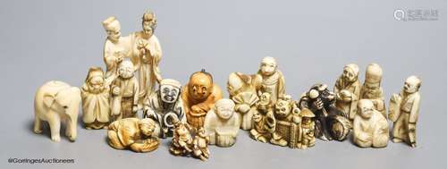 Fourteen Japanese ivory netsuke, a Chinese ivory group and e...