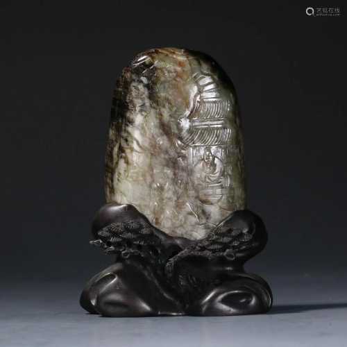 A CHINESE JADE WITH CARVINGS OF LANDSCAPE-AND-FIG…