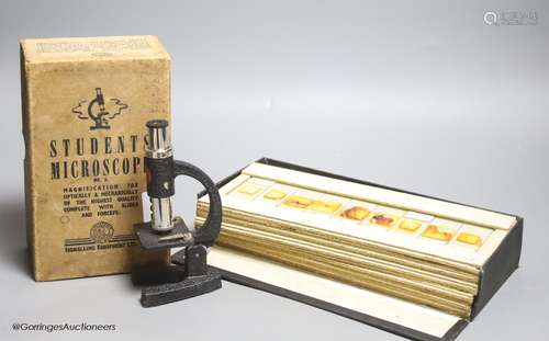 A case of early 20th century microscopes slides and a studen...