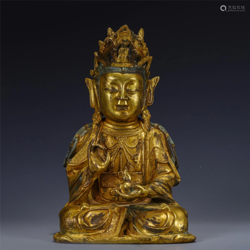 A CHINESE GILDING STATUETTE OF BUDDHA