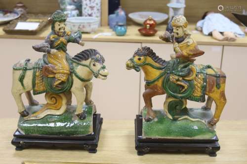 A pair of Chinese Ming sancai ‘horse and rider’ ridge tiles,...