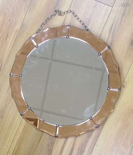 A 1930's tinted glass wall mirror, diameter 46cm