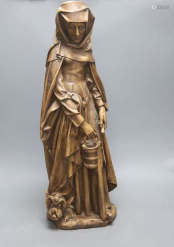 A large painted plaster statue of St Martha, height 70cm