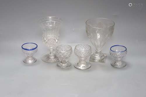 Four 18th century sweetmeat glasses, two with applied blue c...