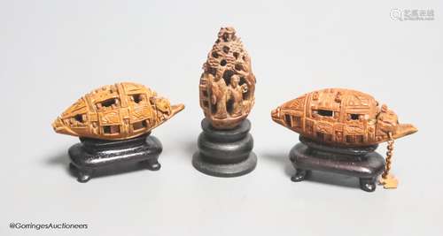 Three Chinese peach stone carvings on stands