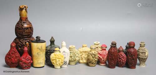 A large Chinese 20th century carved snuff bottle and smaller...