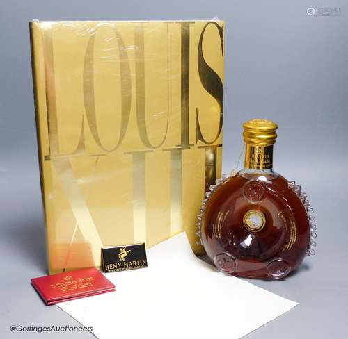 A sealed bottle of Louis XIII Remy Martin Grand Champagne Co...