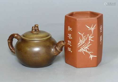 A Chinese Yixing teapot and brush pot with calligraphy and s...