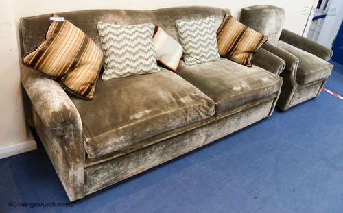 A grey velvet two seat sofa bed, approximately 191 cm wide a...