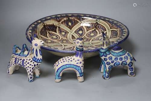 A Moroccan pottery dish, diameter 36cm, and three fritware a...