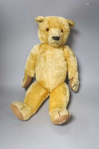 An early 20th century Chad Valley blonde plush teddy bear, l...