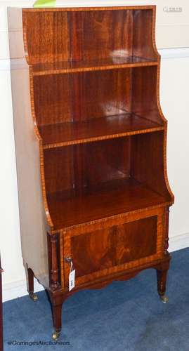 A Sheraton revival inlaid mahogany waterfall bookcase, 114.5...