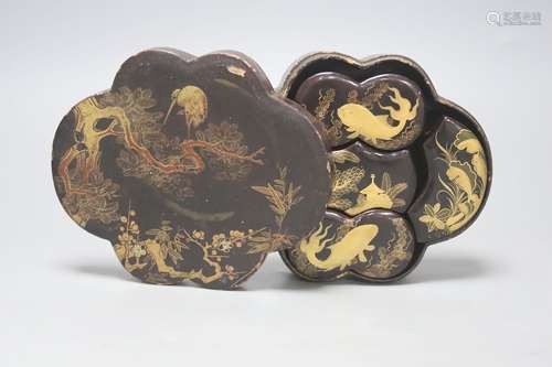 A Japanese black-lacquered box and cover, of shaped oval for...