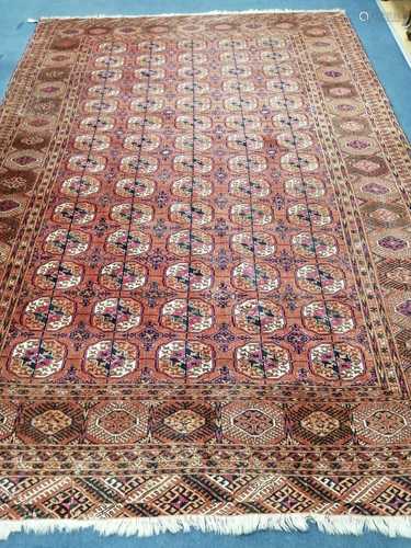 A Tekke Bokhara terracotta field multi medallion rug, 320×21...