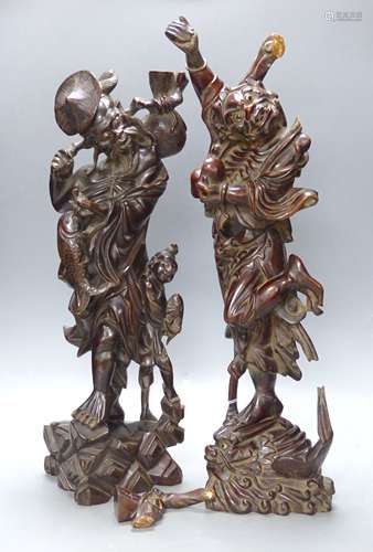 Two early 20th century Chinese hardwood figures of a demon a...