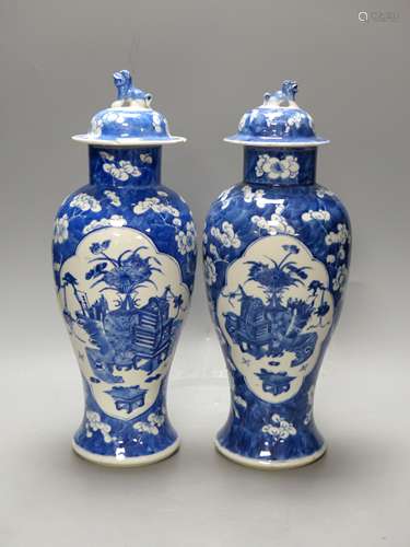 A pair of 19th century Chinese blue and white prunus vases a...