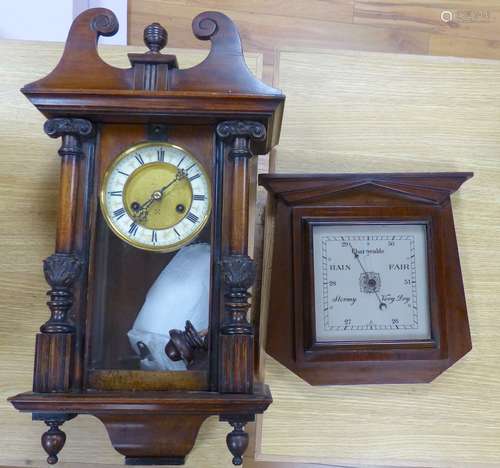 A 19th century German walnut wall clock with pendulum and ke...