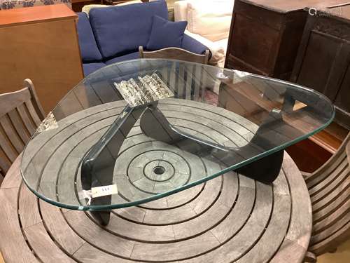 A Isamu Noguchi style coffee table,the triangular heavy glas...