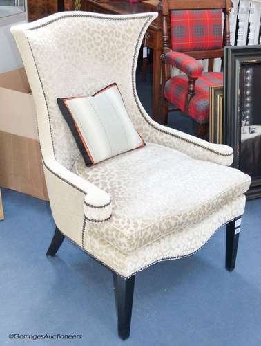 A contemporary upholstered armchairProvenance - a country es...