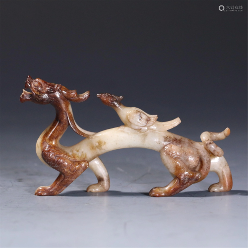 A CHINESE JADE CARVING OF MYTHICAL BEASTS