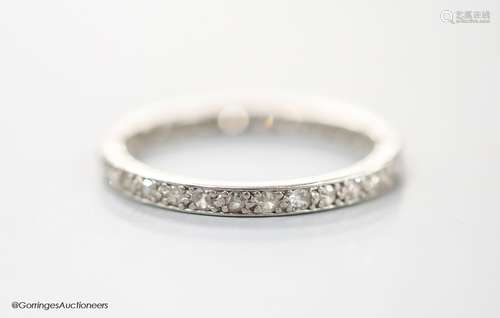 A white metal and diamond chip set full eternity ring, size ...