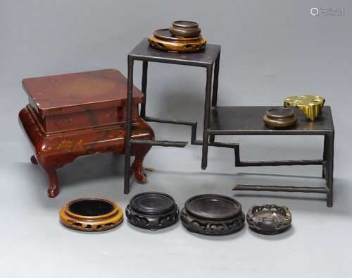 A group of Chinese wooden and bronze stands, tallest 15cm