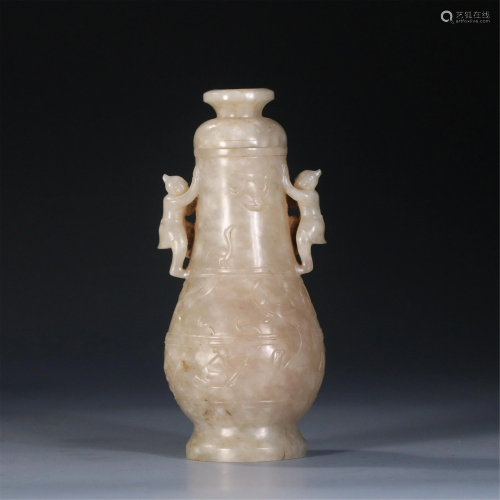 A CHINESE CARVED DOUBLE HANDLED JADE VASE AND COVER