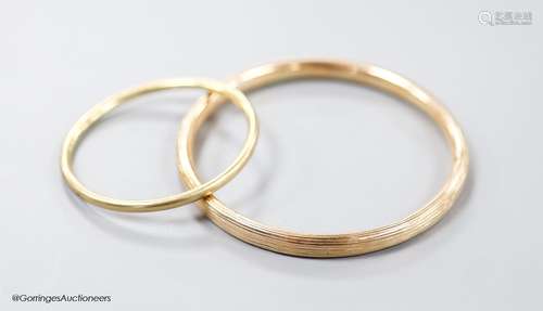 Two yellow metal bangles, the smallest stamped 9ct,gross 15....