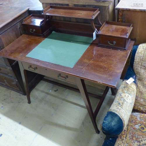 An Edwardian Arts & Crafts mahogany desk, width 111cm