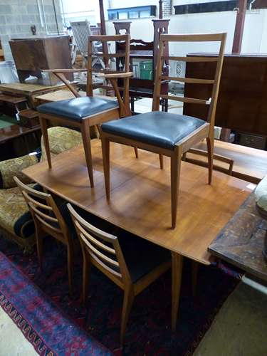 A mid century H McIntosh, extending teak dining suite compri...