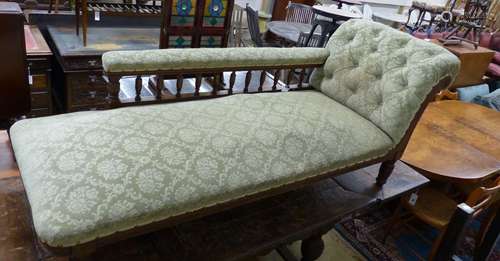 An Edwardian oak chaise longue