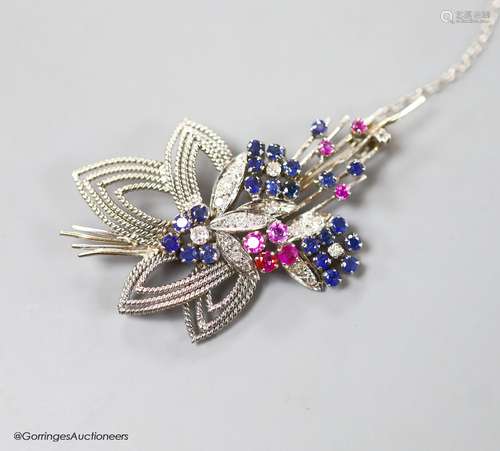 A modern white metal, ruby, sapphire and diamond set foliate...