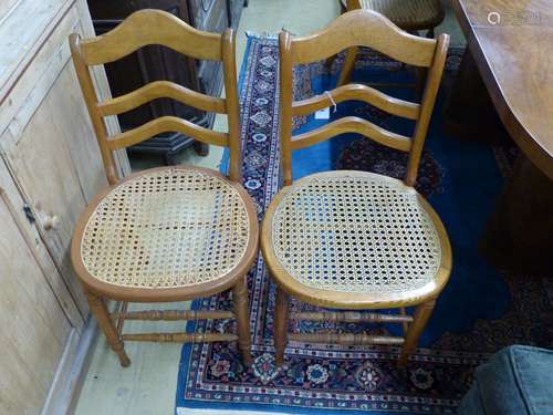 A set of six late Victorian beech kitchen chairs with caned ...